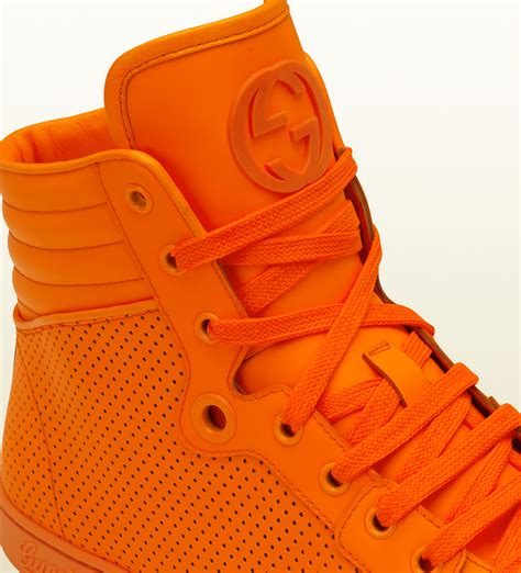 orange Gucci sneakers